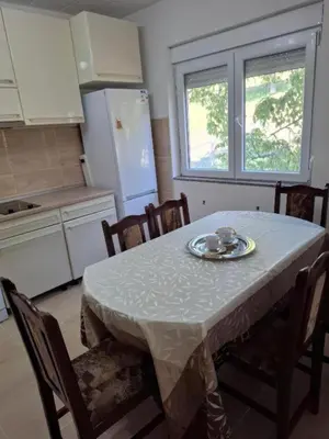 a kitchen with a table with a plate on it at Modern Spacious ViS Raska Apartment! 5min Cafes in Raška