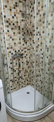 a shower with a glass enclosure in a bathroom at Apartman Seka in Vrnjačka Banja