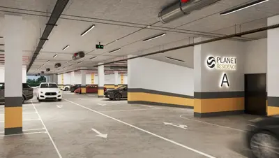 a parking garage with cars parked in it at Skyline Lux Apartment by Planet Residence in Niš