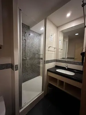 a bathroom with a shower and a sink at Angela 103 in Kopaonik