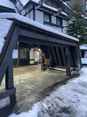 a pavilion with a bench in front of a building at Angela 103 in Kopaonik