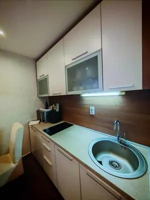 a kitchen with a sink and a microwave at Magic Apartman Kop - Kraljevi Cardaci in Kopaonik