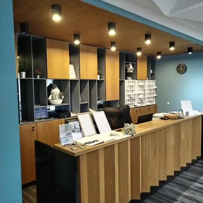 an office with a long desk with chairs and a counter at Apartman Nik Brzeće Kopaonik in Brzeće
