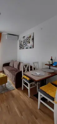 a living room with a couch and a table at Apartman K2 in Vrnjačka Banja