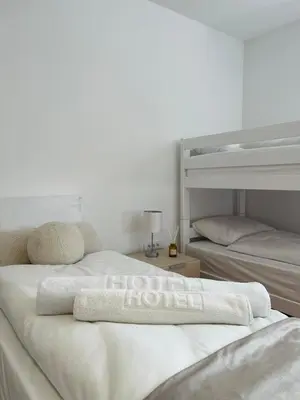 a bedroom with two bunk beds with a towel on top at Talia in Niš