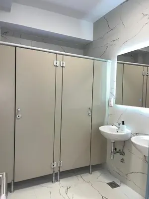 a bathroom with white cabinets and a sink at Talia in Niš