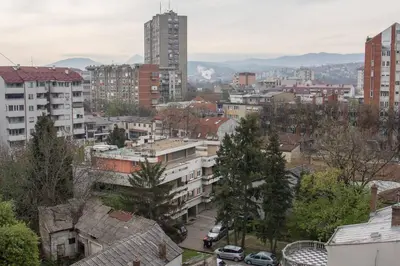 a view of a city with buildings and cars at The Sunny Peach in Niš