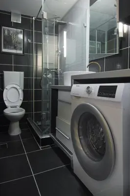 a bathroom with a washing machine and a toilet at The Sunny Peach in Niš