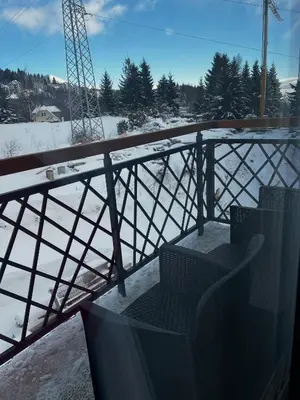 a view from the balcony of a building in the snow at Residence Hill A84 in Kopaonik