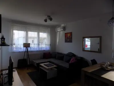 a living room with a couch and a table at Suncokret in Kruševac