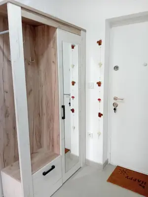 a bathroom with a shower and a glass door at Suncokret in Kruševac