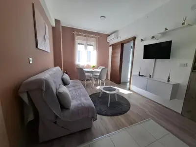 a living room with a couch and a table at Apartman Dora in Jagodina