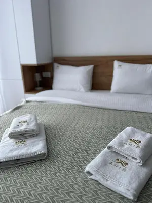 a hotel room with two towels on a bed at Snowflake A10 in Kopaonik