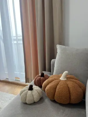 three stuffed teddy bears sitting on a couch at Apartman Alibi in Kopaonik