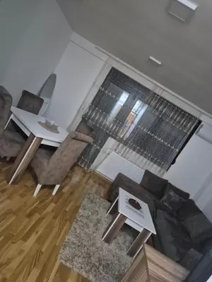 a living room with a couch and a table at Maki Aki Apartman in Jagodina