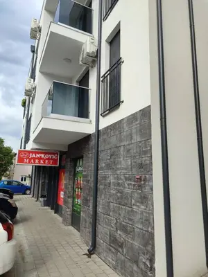 a building with two balconies on the side of it at Tiha noć II Vrnjačka Banja in Vrnjačka Banja