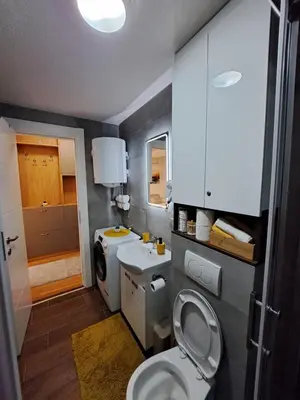 a bathroom with a toilet and a sink at Tiha noć II Vrnjačka Banja in Vrnjačka Banja
