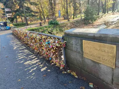 a fence covered with lots of locks at Tiha noć II Vrnjačka Banja in Vrnjačka Banja