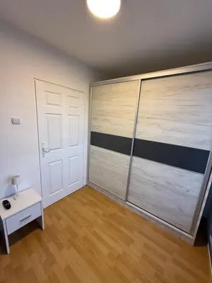 a room with a large sliding garage door at Stošić Apartments in Zaječar