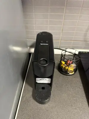 a food processor sitting on the floor of a bathroom at Stošić Apartments in Zaječar