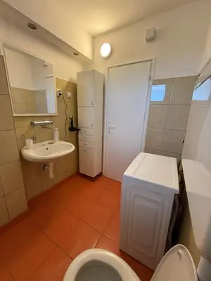 a bathroom with a toilet and a sink at Stošić Apartments in Zaječar