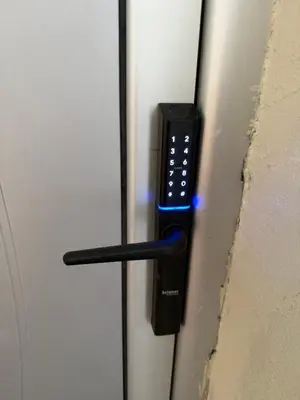 a door with a remote control sticking out of it at Stošić Apartments in Zaječar