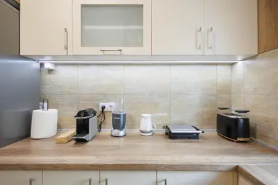 a kitchen counter with some appliances on it at M&M apartment in Pirot