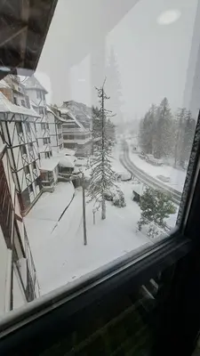 a view of a snow covered street from a window at Apartman Bjanka 308 in Kopaonik