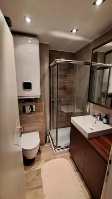 a bathroom with a shower and a toilet and a sink at Apartman Bjanka 308 in Kopaonik