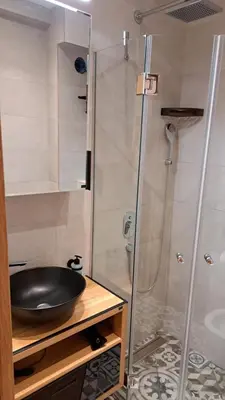a bathroom with a sink and a shower at Apartmani U CASA DI LEGNO 2,5,8,11 in Kopaonik