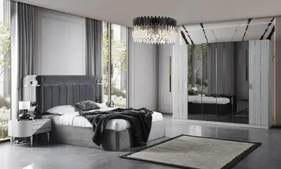 a bedroom with a bed and a large mirror at Magic house in Bukorovac