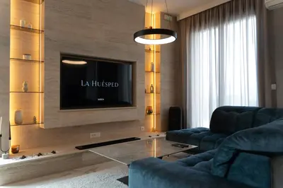 a living room with a couch and a tv at 501 View Vrnjacka Banja in Vrnjačka Banja
