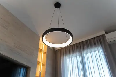 aendant light hanging from a ceiling with a window at 501 View Vrnjacka Banja in Vrnjačka Banja