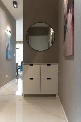 a white dresser in a room with a mirror at 501 View Vrnjacka Banja in Vrnjačka Banja