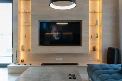 a living room with a television on a wall at 501 View Vrnjacka Banja in Vrnjačka Banja