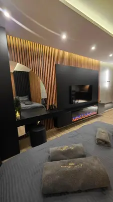 a bedroom with a bed with two pillows on it at Luxe Horizon & Spa Apartments Kopaonik in Kopaonik