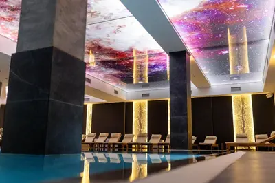 a room with a pool and a ceiling with stars at Luxe Horizon & Spa Apartments Kopaonik in Kopaonik