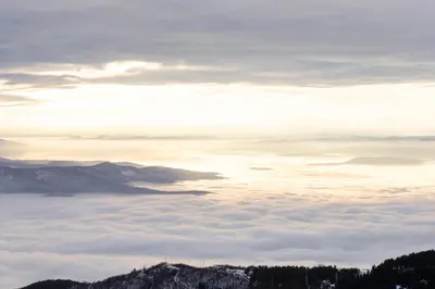 a view from the top of a mountain above the clouds at Luxe Horizon & Spa Apartments Kopaonik in Kopaonik