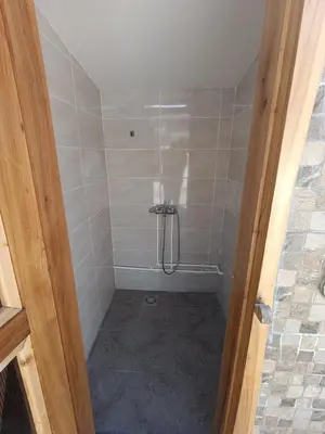 a bathroom with a shower with a shower at Apartman Marina i Sobe Luka in Bukorovac