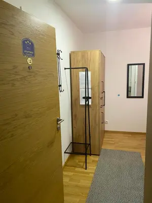 a door with a sign on it in a room at Apartman Živković in Vrnjačka Banja