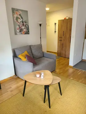 a living room with a couch and a table at Apartman Živković in Vrnjačka Banja
