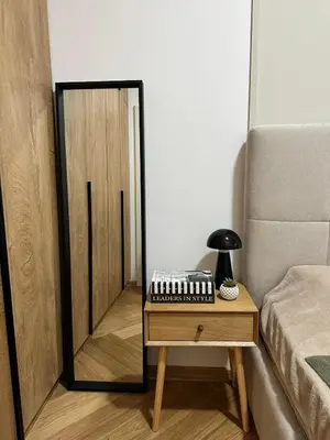 a room with a mirror and a table with a keyboard at Green Oasis in Vrnjačka Banja