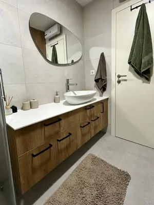 a bathroom with a sink and a mirror at Green Oasis in Vrnjačka Banja