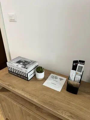 two stacks of books sitting on top of a table at Green Oasis in Vrnjačka Banja