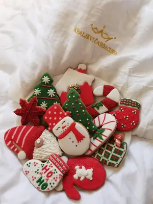 a pile of christmas cookies on a bed at Apartments A83 & C32 - Kraljevi Čardaci - Kopaonik in Kopaonik