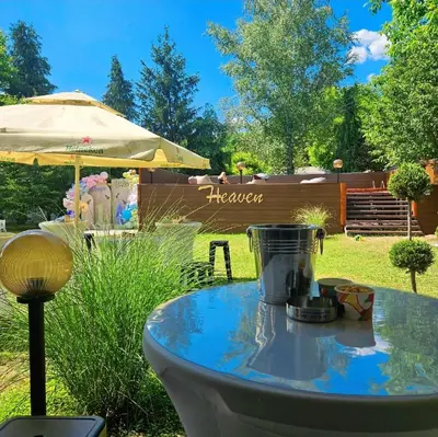 a table with a blender on it in a yard at Heaven in Niš