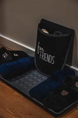 a pair of black and blue shoes on a table at VujSki - Gondola Apartman in Brzeće
