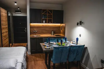 a kitchen with a table with a fish tank on it at VujSki - Gondola Apartman in Brzeće