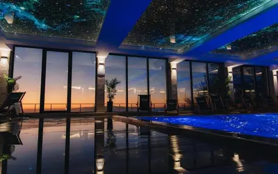 a starry sky over a swimming pool in a house at Milmari Bonita Nlux87 in Kopaonik