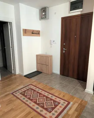 a room with a door and a rug on the floor at Mimi -Green Hill in Soko Banja